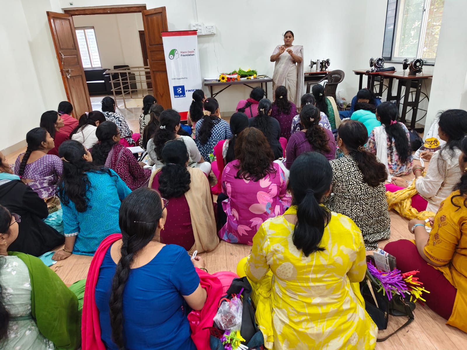 View from the back of the hall of women attending a training session